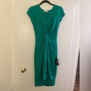 Brand new - never worn with tags! Green twist front high/low dress
